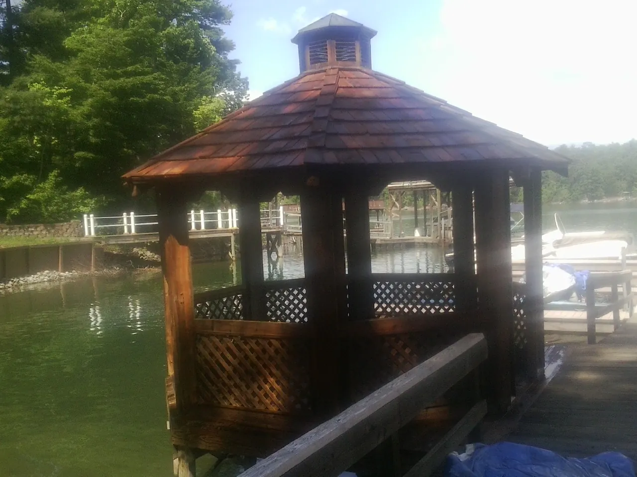 Cedar shake gazebo roof rebuilt on a lake dock in South Acworth